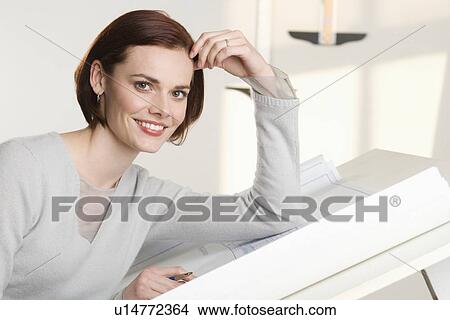 Portrait of woman at drawing board View Large Photo Image Picture - Portrait of woman at drawing board. Fotosearch