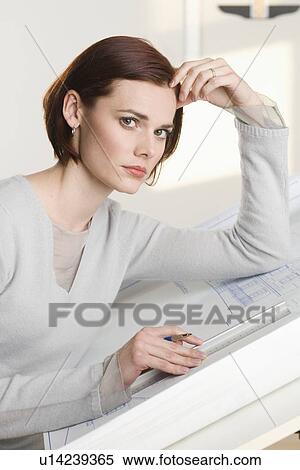 Stock Photography - Portrait of woman at drawing board. Fotosearch