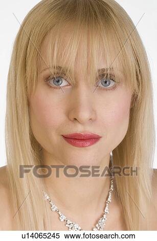 Stock Photography - Portrait of woman wearing necklace. Fotosearch
