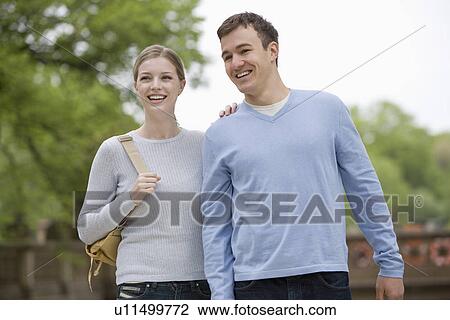 Portrait of young couple outdoors View Large Photo Image Stock Image - Portrait of young couple outdoors. Fotosearch