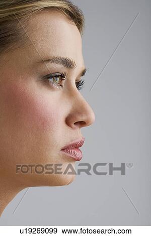 Portrait of young woman in profile View Large Photo Image Stock Photo - Portrait of young woman in profile. Fotosearch