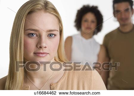 Portrait of young woman with two friends View Large Photo Image Stock Image - Portrait of young woman with two friends. Fotosearch