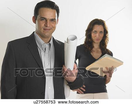 Professional male holding blueprints View Large Photo Image Stock Image - Professional male holding blueprints. Fotosearch