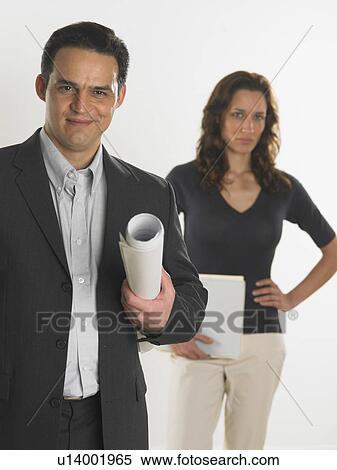 Stock Photography - Professional male holding blueprints. Fotosearch