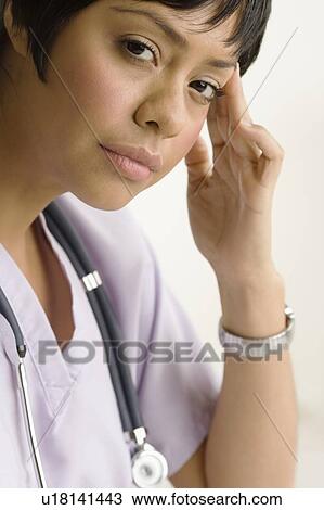 Profile view of a concerned health practitioner View Large Photo Image Stock Image - Profile view of a concerned health practitioner. Fotosearch