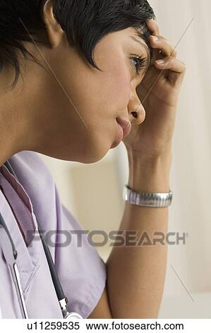 Stock Photography - Profile view of a female health practitioner. Fotosearch