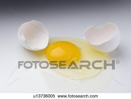 Raw egg cracked open View Large Photo Image Stock Photography - Raw egg cracked open. Fotosearch