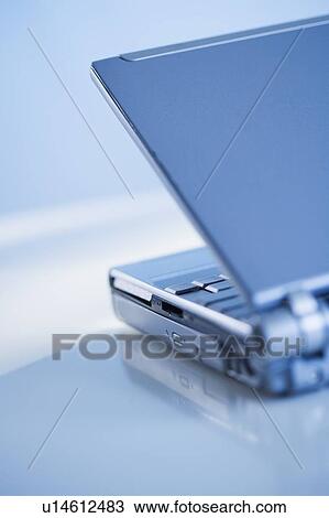 Stock Image - Rear view of open laptop computer. Fotosearch