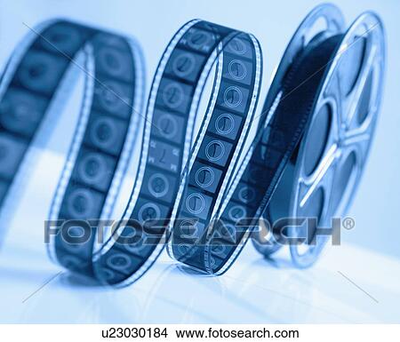 Reel of movie film unrolling View Large Photo Image Picture - Reel of movie film unrolling. Fotosearch