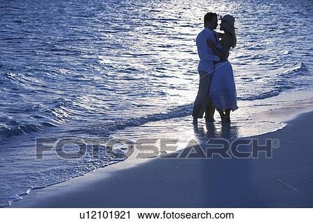 Romantic couple on beach View Large Photo Image Stock Image - Romantic couple on beach. Fotosearch