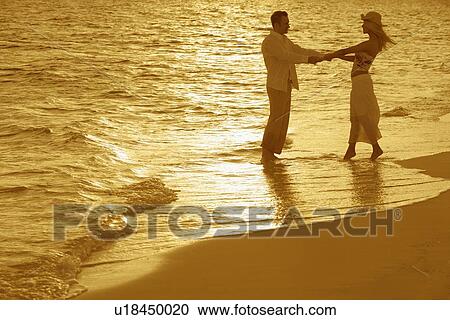 Romantic couple on beach View Large Photo Image Stock Image - Romantic couple on beach. Fotosearch