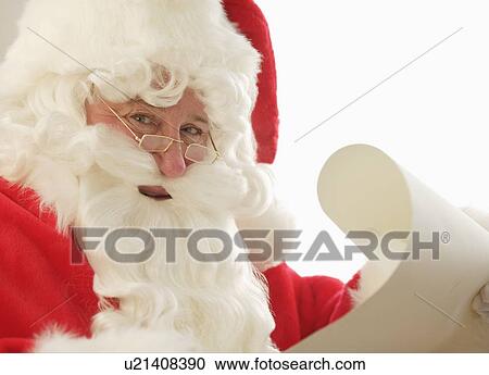 Santa checking his list View Large Photo Image Stock Image - Santa checking his list. Fotosearch