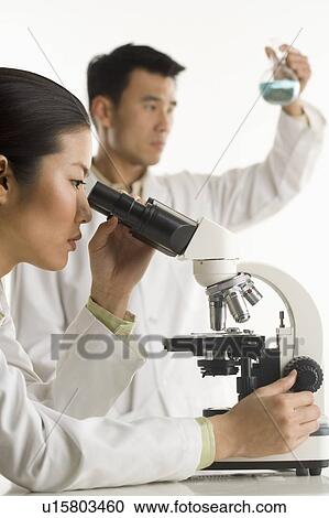 Scientists with beaker and microscope View Large Photo Image Stock Image - Scientists with beaker and microscope. Fotosearch