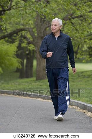 Senior man power walking View Large Photo Image Stock Photo - Senior man power walking. Fotosearch