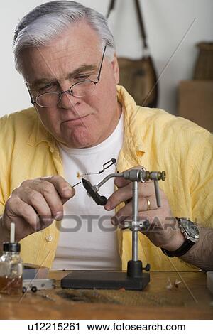Senior man using soldering iron View Large Photo Image Stock Image - Senior man using soldering iron. Fotosearch