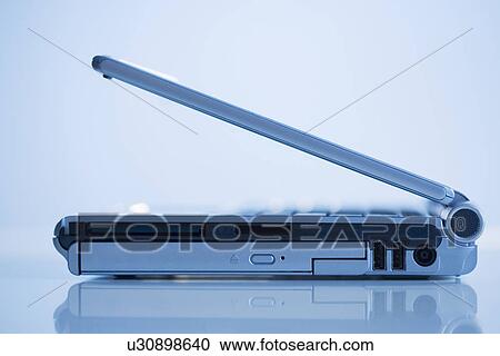 Side view open laptop computer View Large Photo Image Stock Image - Side view open laptop computer. Fotosearch