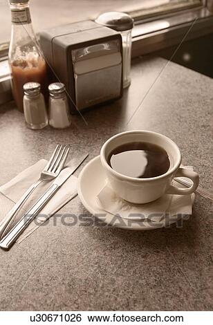 Stock Photograph - Sill life of a cup of coffee. Fotosearch