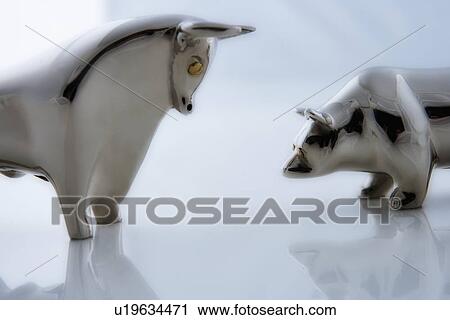 Silver statuettes facing-off View Large Photo Image Stock Image - Silver statuettes facing-off. Fotosearch