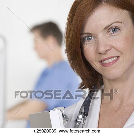Smiling female healthcare professional View Large Photo Image Stock Photo - Smiling female healthcare professional. Fotosearch