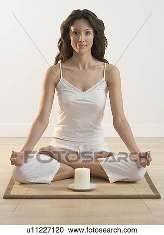 Smiling woman doing yoga View Large Photo Image Stock Image - Smiling woman doing yoga. Fotosearch