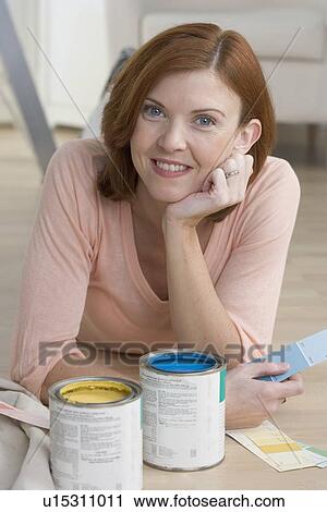 Smiling woman with paint samples View Large Photo Image Stock Image - Smiling woman with paint samples. Fotosearch