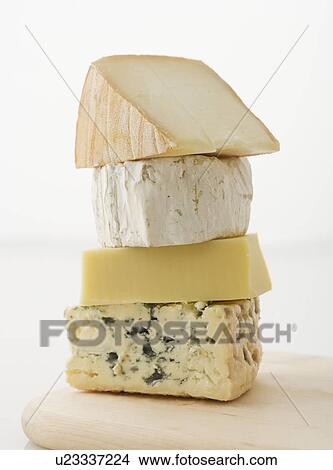 Stacked blocks of cheese View Large Photo Image Picture - Stacked blocks of cheese. Fotosearch