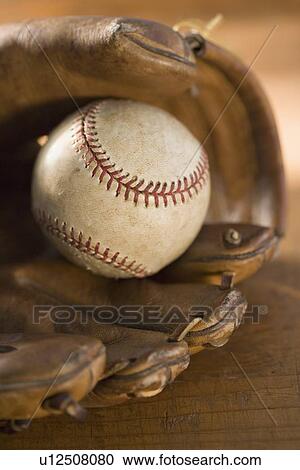 Still life of a baseball glove and ball View Large Photo Image Stock Image - Still life of a baseball glove and ball. Fotosearch