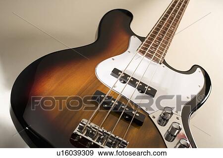 Still life of a bass guitar View Large Photo Image Stock Photo - Still life of a bass guitar. Fotosearch