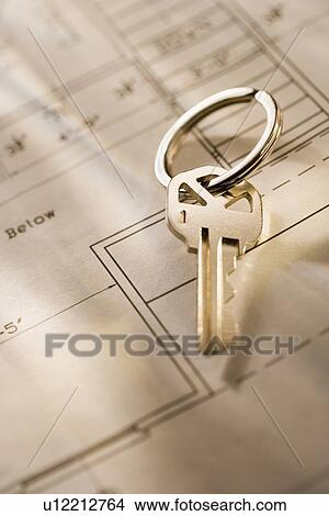 Picture - Still life of a key on blueprint . Fotosearch