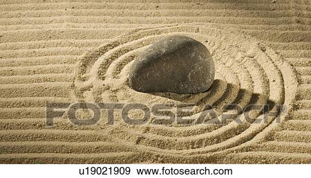 Still life of a stone on sand View Large Photo Image Stock Photo - Still life of a stone on sand. Fotosearch
