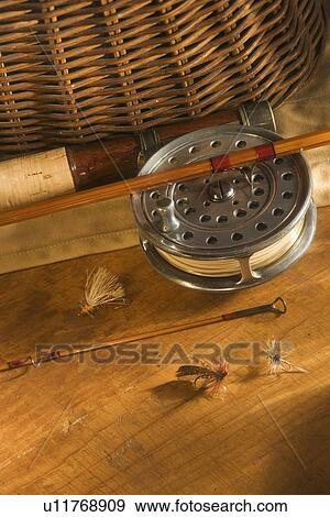 Still life of antique fishing reels View Large Photo Image Stock Photo - Still life of antique fishing reels. Fotosearch