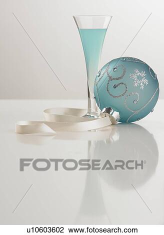 Still life of beverage and Christmas ornament View Large Photo Image Stock Image - Still life of beverage and Christmas ornament. Fotosearch