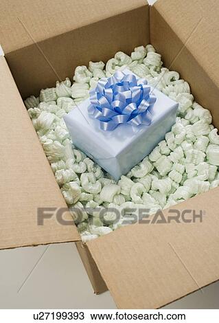 Still life of box of Styrofoam with gift View Large Photo Image Stock Image - Still life of box of Styrofoam with gift. Fotosearch