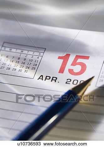 Stock Image - Still life of calendar page of April 15. Fotosearch