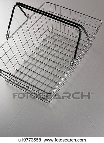 Still life of empty shopping basket View Large Photo Image Stock Photo - Still life of empty shopping basket. Fotosearch