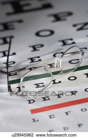 Still life of eye chart and glasses View Large Photo Image Stock Image - Still life of eye chart and glasses. Fotosearch