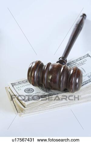 Stock Image - Still life of gavel and money. Fotosearch