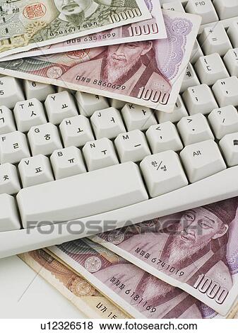 Still life of keyboard and Korean money Won View Large Photo Image Stock Photo - Still life of keyboard and Korean money Won. Fotosearch