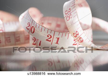 Stock Photograph - Still life of measuring tape. Fotosearch