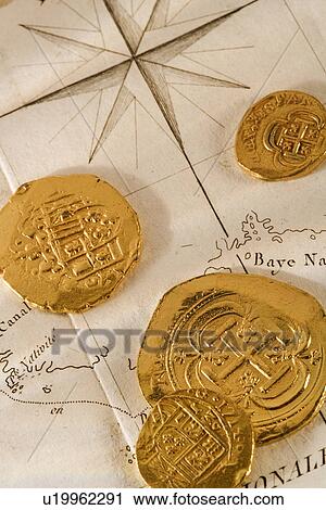 Still life of pieces of gold and map View Large Photo Image Stock Image - Still life of pieces of gold and map. Fotosearch