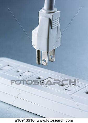 Stock Image -  Still life of plug and outlet. Fotosearch