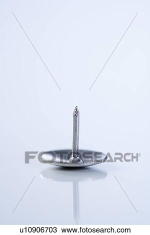 Stock Image - Still life of thumb tack. Fotosearch