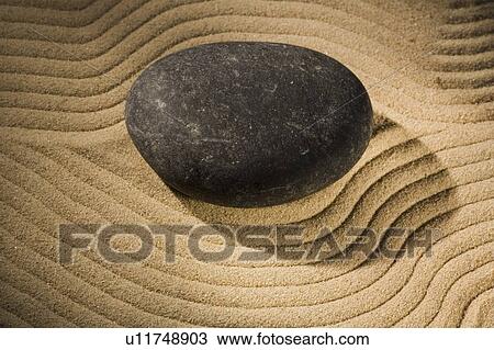 Stock Image - Stone with grooved sand. Fotosearch