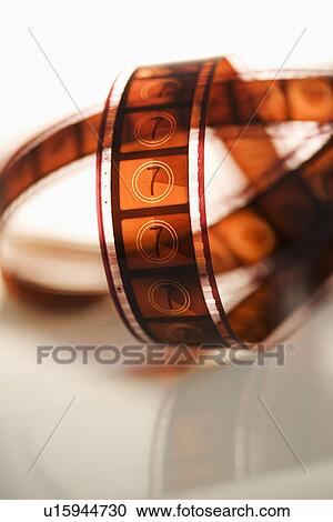 Strip of film on table indoors View Large Photo Image Stock Image - Strip of film on table indoors. Fotosearch