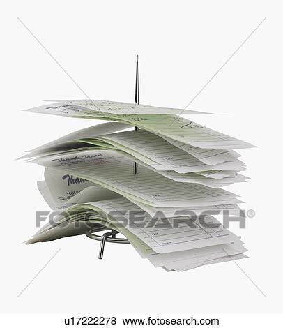 Studio shot of receipts on spike View Large Photo Image Stock Photo - Studio shot of receipts on spike. Fotosearch