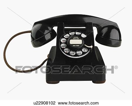 Stock Image - Studio shot of rotary telephone. Fotosearch