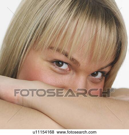 Stock Photo - Studio shot of woman smiling. Fotosearch