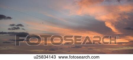Sunlight from behind clouds View Large Photo Image Stock Image - Sunlight from behind clouds. Fotosearch