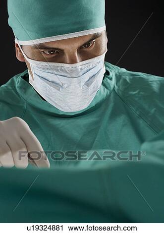 Stock Image - Surgeon at work. Fotosearch