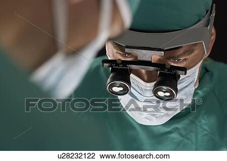 Stock Image - Surgeon at work. Fotosearch